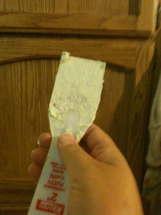 small amount of Spackle on the putty knife 