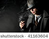 GOOD OL' "BRUISER," THE CHICAGO GANGSTER LET ME SMOKE UNFILTERED CAMEL CIGARETTES WITH HIM, BUT NEVER TOOK THE BLAME.
