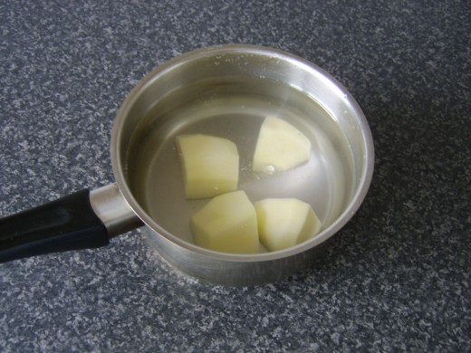 Peel and quarter the potato and add it to a pot of cold, slightly salted water