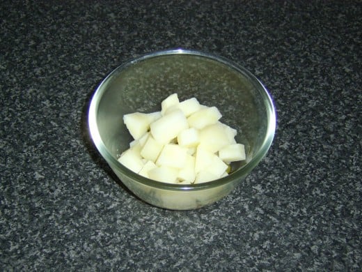 Potato is diced and also added to the bowl