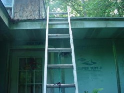 Cleaning out Clogged Gutters and Downspouts