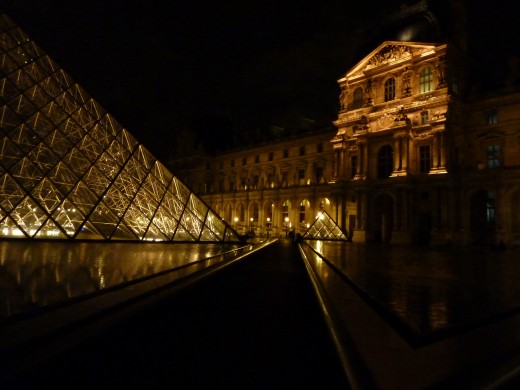 The Louvre Museum and Pyramid at night