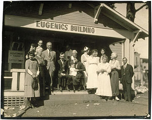 Winning family of a Fitter Family contest stand outside of the Eugenics Building (where contestants register) at the Kansas Free Fair, in Topeka, KS
