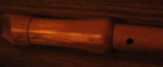 The hole on the underside of a recorder allows the player a whole octave of higher notes simply by uncovering only half of it with your finger.