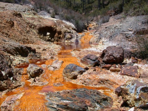 Human Impact: Acid mine drainage causes severe environmental problems in the Rio Tinto, Spain.