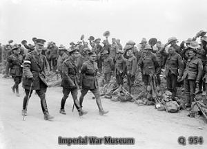 HM King George V (front centre) inspecting New Zealand battalions about to entrain at Steenwerck.