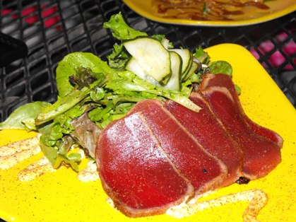 Delicate slices of Ahi Tuna, blackened and seared rare with a Mrzen Balsamic Vinaigrette, and drizzled with Cajun remoulade...did I mention that I love to eat?