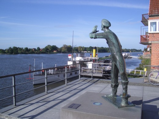 Brass guy shouting at boats