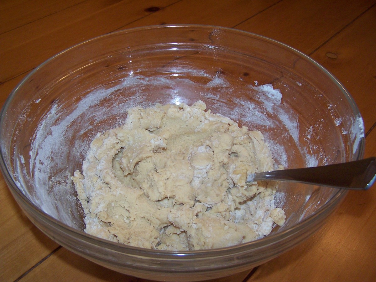 Slowly add the flour mixture to the larger bowl and stir until a nice cookie dough is formed.