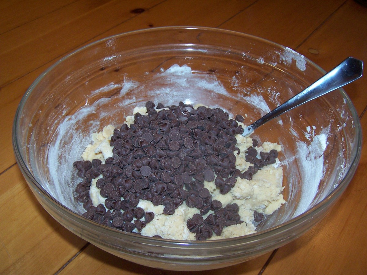 Now for the good part - Pour in the enitre 12 oz. bag of Nestle semi-sweet chocolate chips into the dough.
