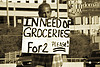 THIS PANHANDLER IS VERY WISE TO ADVERTISE HIS NEED. THIS TAKES WITTY CREATIVITY.