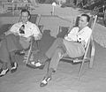 J. Edgar Hoover and his assistant Clyde Tolson sitting in beach lounge chairs, circa 1939
