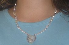 This is what a handmade necklace with a heart pendant looks like when completed.