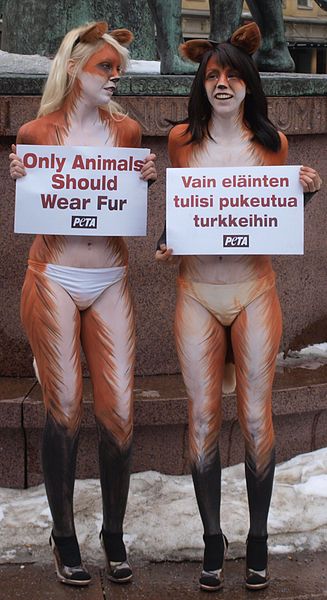 The signs say "Only animals should wear fur" in both Finnish and English.