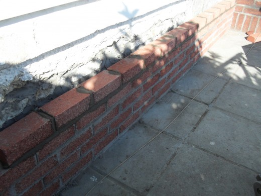 Laying the new bricks.