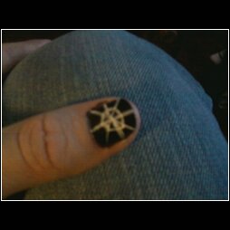 Start the fun part. I chose to do the spider web but I am sure with practice I could do a skull or ghost. Use an Art deco or some sort of nail art polish to create you design.
