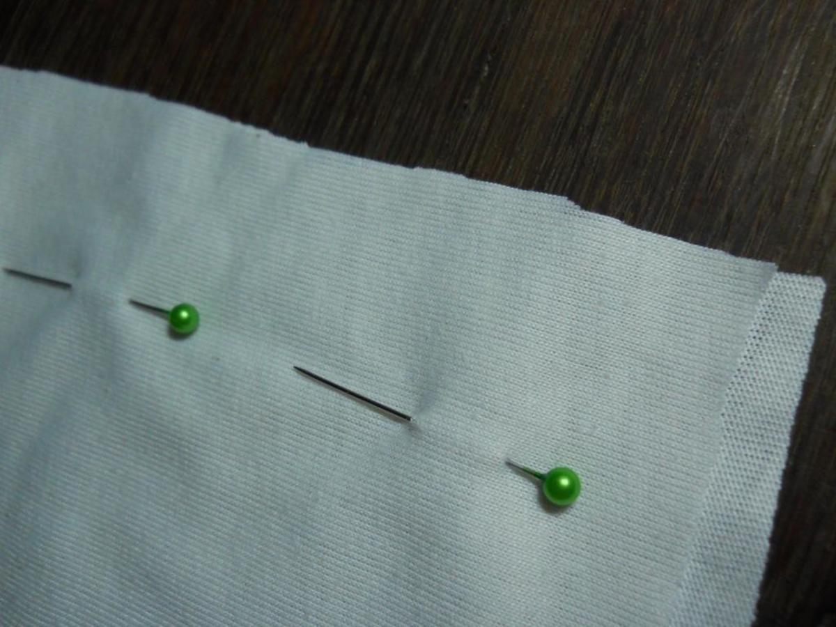 I used sewing pins to keep the lining cloth from shifting while I stitched it.