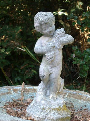 I will frequently take a series of photos that have something striking in them.This bird bath angel was one of those things that needed a closer shot!