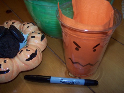 Draw monster faces on the clear plastic cups. Let the kids join in and use their imaginations!