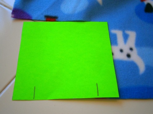 Using the 1" mark on the green card, cut along green card.  You should get 1" by 5" strip.