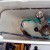 The old valve is removed, giving a good view of the flapper in the center of the tank. The old valve is removed, giving a good view of the flapper in the center of the tank.