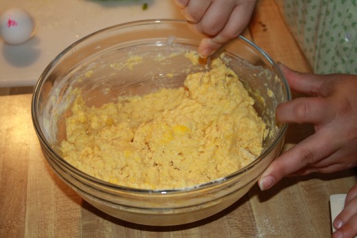 First, let's add the milk and egg and mix with a spoon.