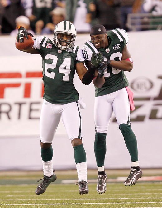 New York Jets Darrelle Revis  and  Santonio Holmes celebrate Revis' 100-yard interception return for a TD against the Miami Dolphins