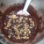 11. Sprinkle on your roughly chopped chocolate and nuts. Gently folding into the thick chocolate  mixture.