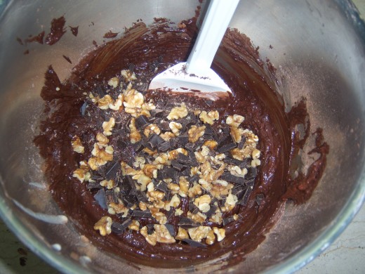 11. Sprinkle on your roughly chopped chocolate and nuts. Gently folding into the thick chocolate  mixture.