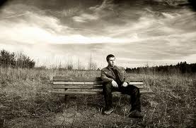 A man who was stood-up by a pretty girl can only ffind peace by himself, his thoughts, on a deserted park bench with dark clouds to keep him company.