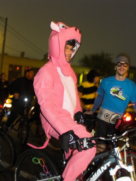 Bright bike wear. Can't miss it! But ruh-roh... where's your helmet, Mr. Piggy?