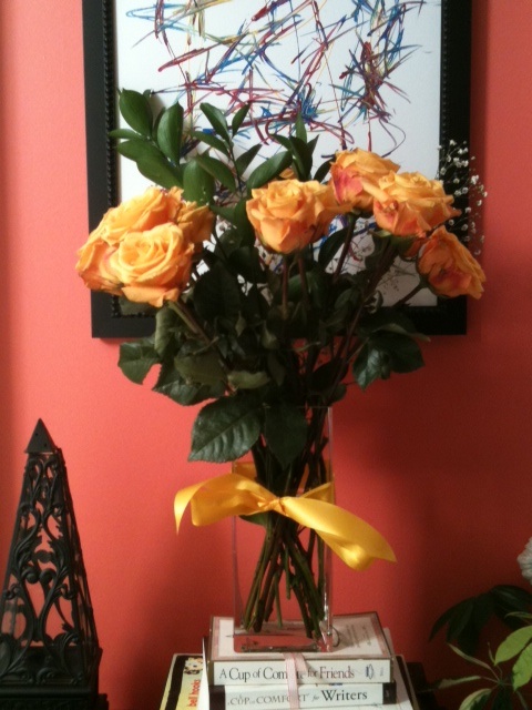 Flowers in any space can add a special touch. Here, they are used in the home office.