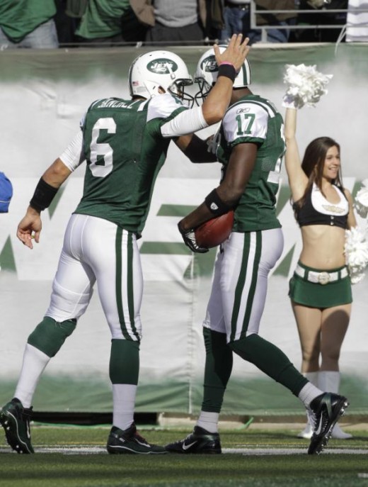 New York Jets' Mark Sanchez congratulates  Plaxico Burress on his TD during the third quarter against the San Diego Chargers, Sunday, Oct. 23, 2011 (AP Photo/Kathy Willens)