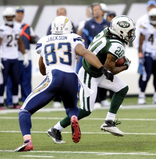 New York Jets' Kyle Wilson, right, intercepts a pass intended for San Diego Chargers' Vincent Jackson (83) during the fourth quarter of an NFL football game, Sunday, Oct. 23, 2011, in East Rutherford, N.J. The Jets defeated the Chargers 27-21.(AP Pho