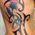 Scottish Thistle with Celtic Trinity Knot in Tribal Background Scottish Thistle with Celtic Trinity Knot in Tribal Background