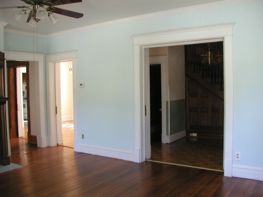 Large oversized double pocket doors leading from entry into living room