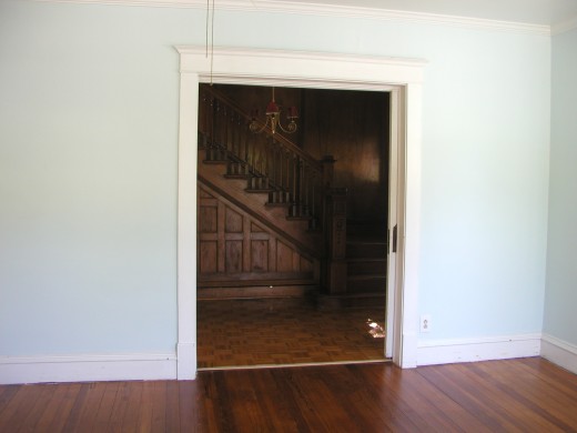 looking into entry way to staircase from living room