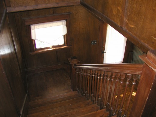 Looking down the grand staircse towards entry way