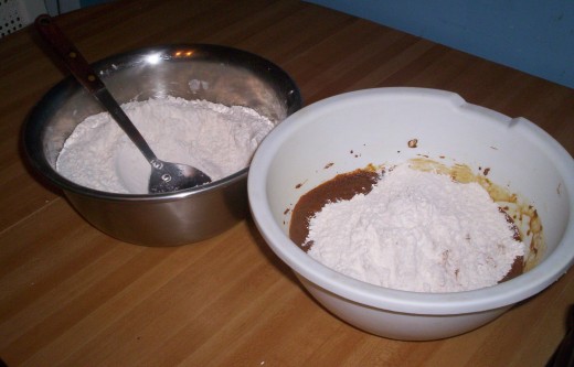 The Flour is gradually added to the wet ingredients.  If the dough is too wet to roll out, add more flour.
