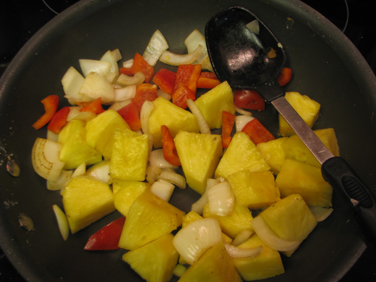 Add pineapple and stir fry until heated through.  Put aside in serving container while you cook the meat.
