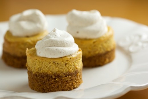Mini pumpkin cheesecakes with just a dollop of whipped cream for decoration.