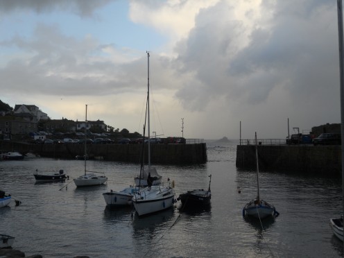 The harbour of a Cornish fishing village at dusk