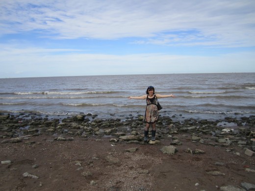 Poet on the beach in Argentina, looking for shells