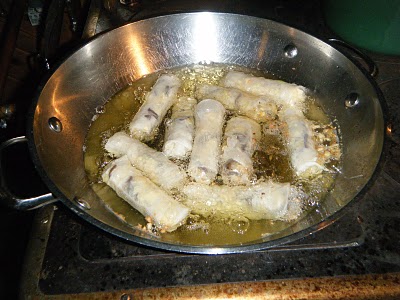 Spring Rolls Frying on Cook Stove Top