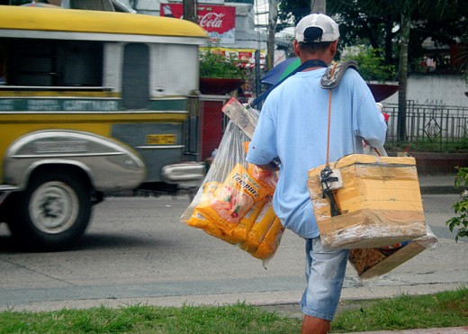 variety is the name of the game for this hawker. He carries frozen goodies inside his styro box