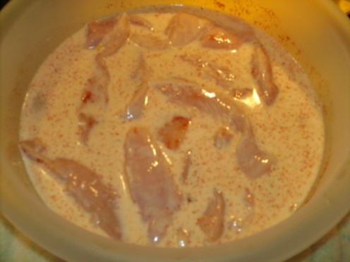 Chicken strips marinated in milk & cayenne pepper powder.