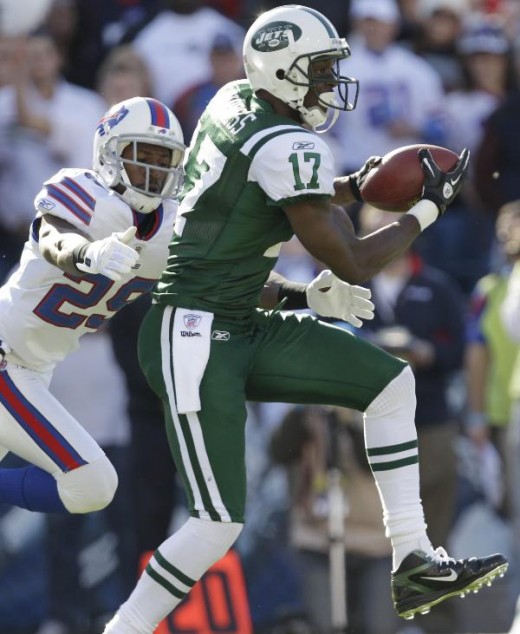 New York Jets' Plaxico Burress (17) makes a catch under pressure from Buffalo Bills' Drayton Florence (29) during the first quarter of an NFL football game in Orchard Park, N.Y., Sunday, Nov. 6, 2011. (AP Photo/David Duprey)