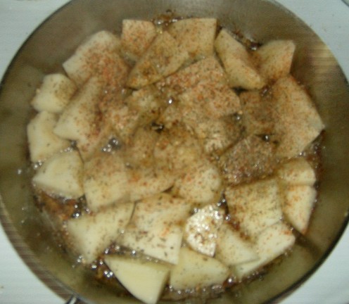 Potatoes with seasoning in oil.