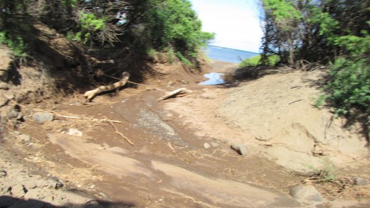 On our way to shipwreck beach and the road was muddy. Our rented jeep was stuck in it for a minute, but we were able to get out.