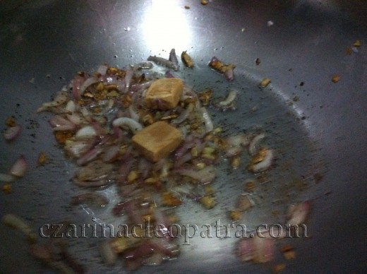 Stir-fry onions with ground pepper and boullion cubes.